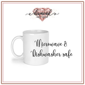 May include: White ceramic mug with black text that reads "Microwave & Dishwasher safe".