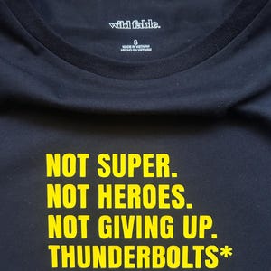 Thunderbolts* Logo / Text Aesthetic Baby Tee