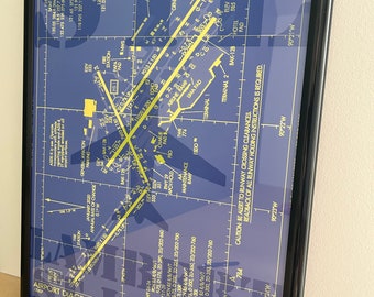 May include: A blue and yellow airport diagram for St. Louis Lambert International Airport (STL) in St. Louis, Missouri. The diagram shows the runways, taxiways, and other airport facilities. The diagram is framed in black.
