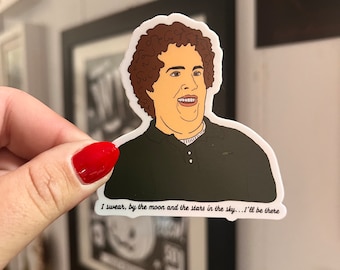 May include: A sticker featuring a cartoon illustration of a man with brown curly hair and a black shirt. The sticker has the text "I swear, by the moon and the stars in the sky...I'll be there."