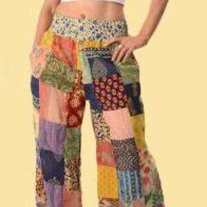 May include: Multicolored patchwork pants with a wide leg and a high waist. The pants are made from a variety of fabrics and have a bohemian style.