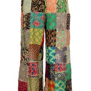 May include: Wide-leg pants with a patchwork design featuring a variety of colorful floral patterns. The pants have a wide, flowing silhouette and a comfortable elastic waistband.