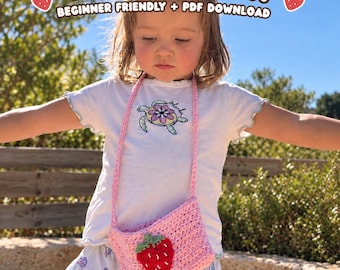 May include: A light pink crochet bag featuring a red strawberry appliqué with green leaves. The bag has a matching pink shoulder strap and is displayed with text that reads CROCHET STRAWBERRY BAG PATTERN BEGINNER FRIENDLY + PDF DOWNLOAD.