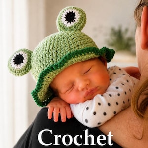 May include: A light green crochet hat featuring two protruding frog eyes with white and black centres and a dark green scalloped brim. The hat is displayed with the text "Crochet children frog hat pattern" printed at the bottom of the image.
