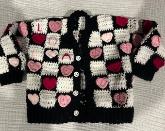 Handmade crochet black and white name embroidered cardigan for toddlers and babies