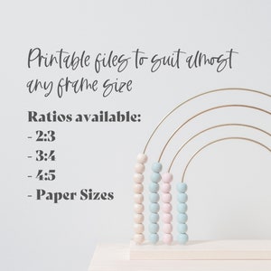 May include: An abacus with pastel pink and blue beads and gold-coloured arches. The text reads "Printable files to suit almost any frame size" and lists ratios: 2:3, 3:4, 4:5, and paper sizes. The abacus sits on a light-coloured wooden base.