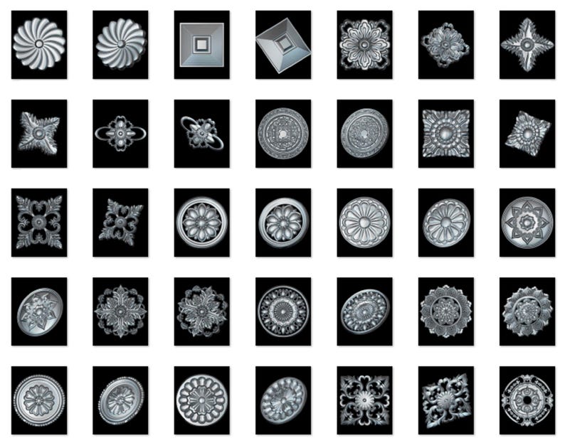 May include: A set of 36 silver-toned metal decorative embellishments with various geometric and floral designs. The embellishments are arranged in a grid pattern on a black background.
