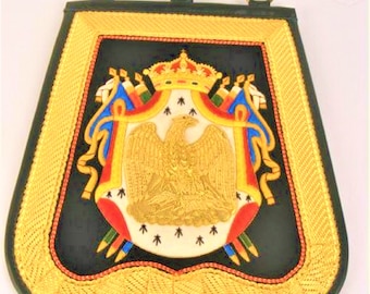 May include: A black velvet banner with a gold embroidered border and a gold embroidered coat of arms featuring a crowned eagle, flags, and a crown.