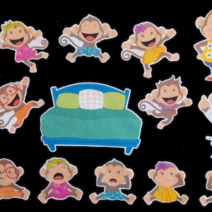 May include: A set of 11 colourful monkey illustrations, including a doctor monkey, a teacher monkey, and a monkey wearing pyjamas. The monkeys are all smiling and have different expressions. There is also a bed in the image.