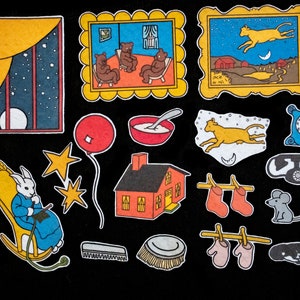 Peut inclure: Ensemble d'illustrations colorées dessinées à la main sur fond noir. Les images comprennent un lapin dans un rocking-chair, une maison, un ballon, des étoiles, un bol de porridge, un chat, une horloge et d'autres objets fantaisistes.