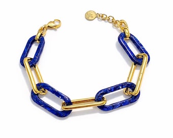 Bracelet made of Large gold plated rings with different flowers and colors