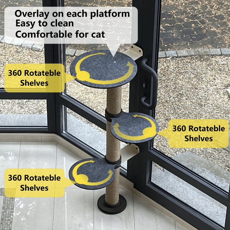 May include: A beige cat tree with three rotating platforms covered in gray fabric. Each platform has a yellow arrow indicating that it rotates 360 degrees. The cat tree is standing on a tiled floor next to a glass door.