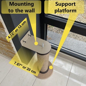 May include: A beige cat scratching post with a beige support platform that mounts to the wall. The post is 7.87 inches or 20 centimeters tall and the platform is 4.72 inches or 12 centimeters wide.