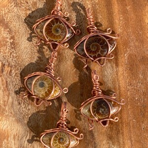 Ammonite Eye of Horus Pendant