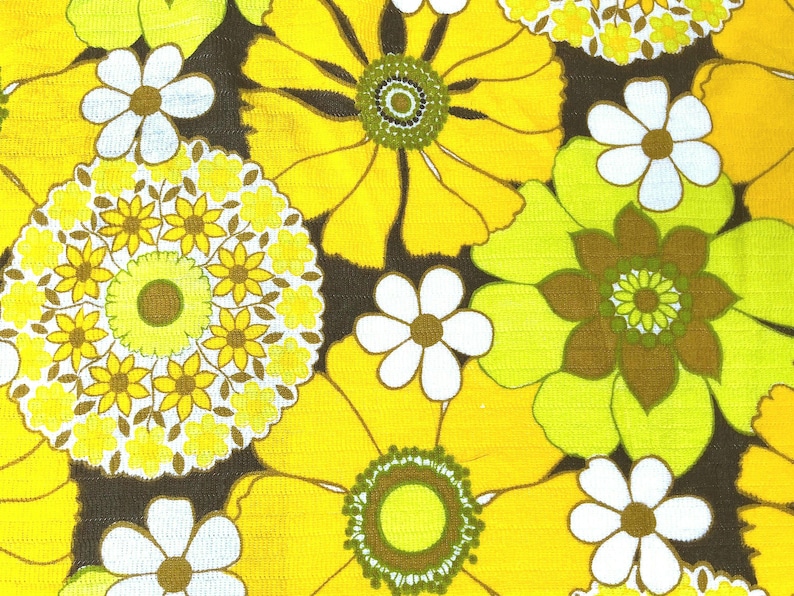 May include: A brown background with a repeating pattern of yellow, green, and white flowers. The flowers have a retro 1970s style.
