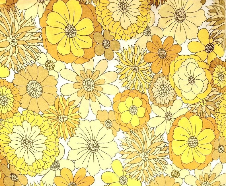 May include: A yellow and white floral pattern fabric with a repeating design of large and small flowers. The fabric has a vintage feel and would be perfect for a variety of projects.