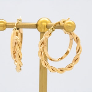 14 karat yellow gold braided hoop earrings