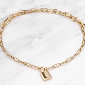 14 karat yellow gold 3mm thick paperclip padlock necklace
