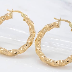 14 karat yellow gold twist hoop earrings