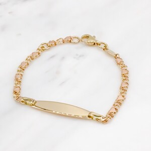 14 karat yellow gold engravable baby ID bracelet with tiny rose gold hearts