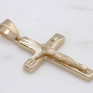 14 karat yellow gold cross with Jesus