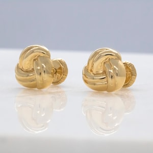 14 karat yellow gold baby love knot earrings