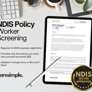 May include: A digital tablet displaying a worker screening policy document with the text "NDIS Policy Worker Screening" and "NDIS Sector Approved" in a gold circle with stars. The document is on a white surface with a keyboard and a pen.