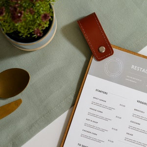 Menu binder designed for organized presentation of your restaurant's offerings. Perfect for keeping your menus in one place and easily accessible.