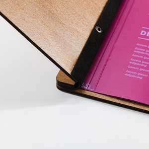 Elevate your brand with our Wooden Menu Holder featuring Logo Engraving. Personalize your presentation with ease using this handcrafted menu folder. Easily swap pages for a fresh, sophisticated look. Discover elegance with our Wooden Menu Cover.