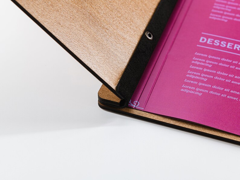 Elevate your brand with our Wooden Menu Holder featuring Logo Engraving. Personalize your presentation with ease using this handcrafted menu folder. Easily swap pages for a fresh, sophisticated look. Discover elegance with our Wooden Menu Cover.