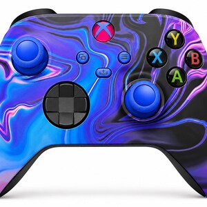 May include: A wireless video game controller featuring a swirling marble pattern in shades of blue, purple, and black. The device includes two blue analogue sticks, a black directional pad, and four action buttons labelled Y, X, B, and A in colours.