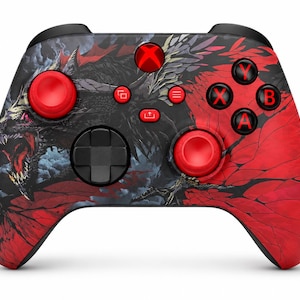May include: A wireless video game controller featuring a black and red dragon graphic across the front shell. The device includes two bright red analogue sticks, a black directional pad, and four black action buttons labelled X, Y, A, and B in red.