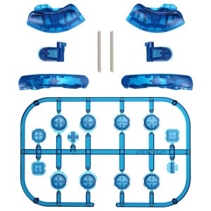 May include: A collection of transparent blue gaming controller parts, including buttons, directional pads, and shoulder buttons. The components are arranged on a blue plastic frame, with two silver metal pins. The image is a top-down view.