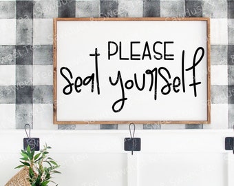 May include: A white sign with a black wooden frame hanging on a black and white checkered wall. The sign says "PLEASE Seat yourself".