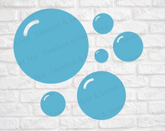 May include: A set of five blue bubble shapes on a white brick background. The bubbles are various sizes and have a white outline.