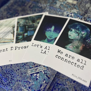 May include: Four rectangular prints featuring dark, atmospheric digital illustrations and text. The prints display imagery of power lines, computer screens, and stylized portraits with the text Present D, Let's All LA, and We are all connected.