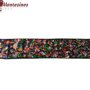 May include: A black table runner with colourful embroidered flowers and birds. The runner is approximately 15 inches wide and features a vibrant floral design.