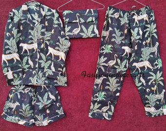 May include: A black pajama set with a jungle print featuring leopards, birds, and palm trees. The set includes a long-sleeved shirt and pants.