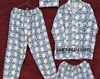 May include: A set of blue and white floral print pajamas, including pants, a button-down shirt, and shorts, along with a matching pouch. The pajamas are displayed on hangers against a dark red background. The text "FASHIONINDIACRAFTS" is visible.