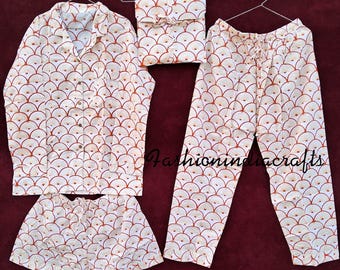 May include: A white and orange pajama set with a fan-shaped pattern. The set includes a long-sleeved shirt, pants, and shorts. The text "Fashionindacrafts" is visible in the image.
