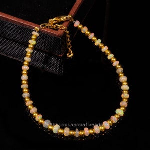 3X5 MM 15.80 Cts Natural ethiopian opal welo fire rondelle bead bracelet 8 Inches, Opal bead bracelet with golden balls, christmas gift