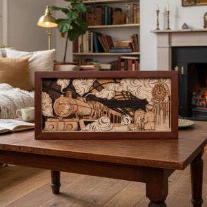 May include: A wooden framed art piece depicting a train at a station, with the text "1972" on the train. The artwork is layered, creating a 3D effect. The frame is dark brown, and the artwork is in shades of brown and beige.