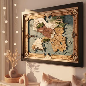 May include: A rectangular, multi-layered wooden wall map featuring a fantasy landscape with raised terrain, carved coastlines, and intricate border details. The map displays various labeled regions, mountain ranges, and bodies of water in shades of brown, green, and blue, all enclosed within a dark, solid frame.