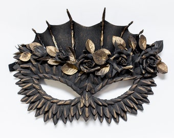 Masquerade mask woman black with a golden tint, with roses and dragon scales for Halloween, parties, clubbing, cosplay