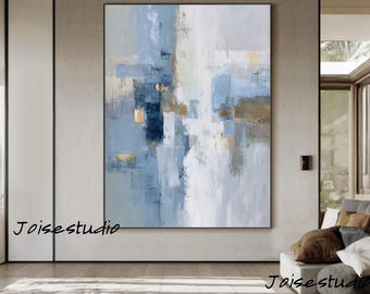 May include: Abstract oil painting on canvas with a palette of blues, whites, and gold. The artwork features textured brushstrokes and a vertical composition. The artist's signature, "Joise studio," is visible in the lower left and right corners.