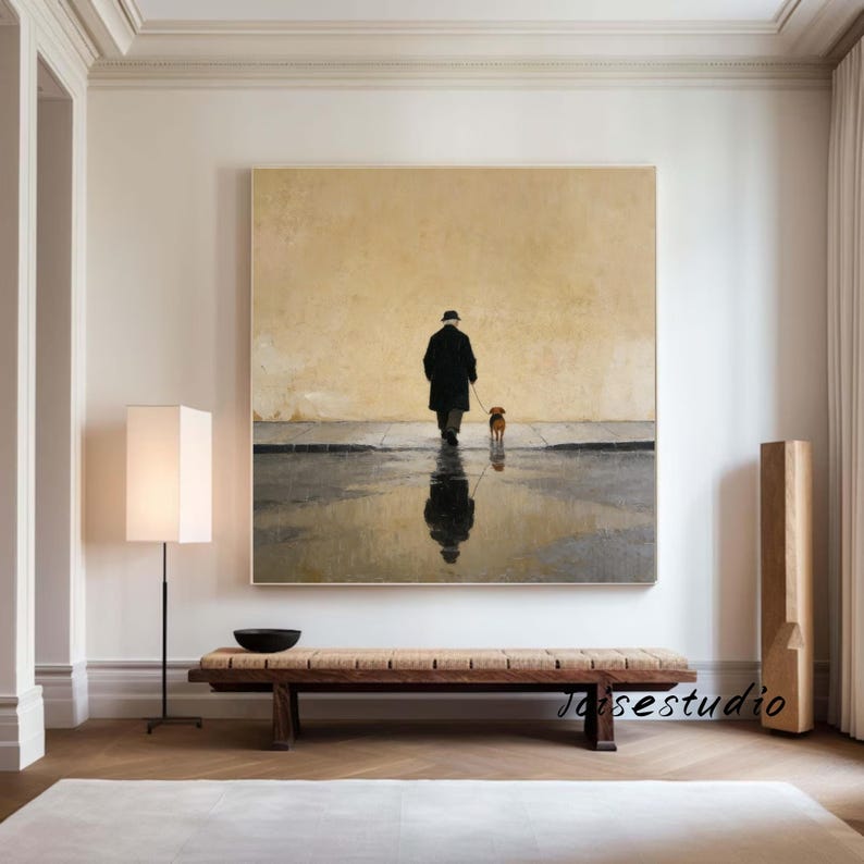 May include: A large square painting depicts a person walking a dog on a wet street. The person is wearing a dark coat and hat. The dog is small and brown. The painting has a muted color palette with a reflection of the person and dog in the water.