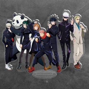 May include: A clear acrylic standee featuring a group of eight anime characters from Jujutsu Kaisen, including a panda, standing in a line. The characters are depicted in various poses wearing dark uniforms, with one character in a light suit.