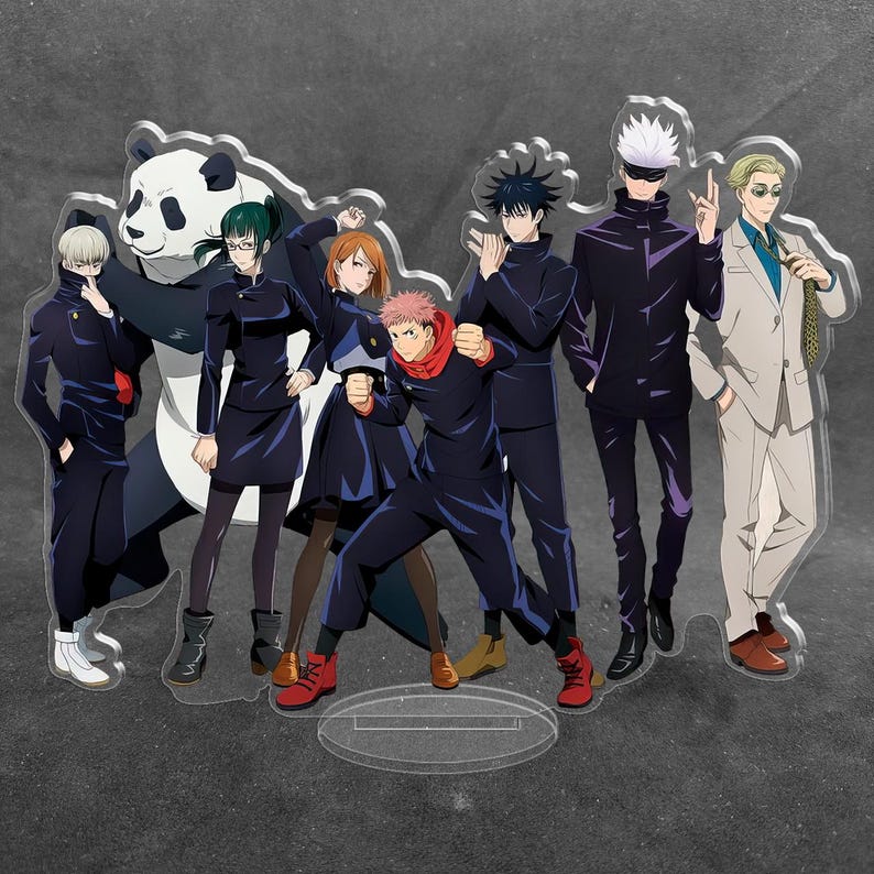 May include: A clear acrylic standee featuring a group of eight anime characters from Jujutsu Kaisen, including a panda, standing in a line. The characters are depicted in various poses wearing dark uniforms, with one character in a light suit.