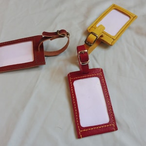 luggage tags, leather suitcase