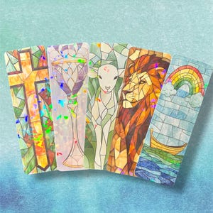May include: Five colorful bookmarks with stained glass designs. The bookmarks feature a cross, a chalice, a lamb, a lion, and a rainbow with a boat on a body of water.